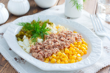 Salad with canned tuna and corn, selective focus