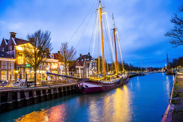 Fototapeta na wymiar Harlingen, Netherlands - January 09, 2020. Boat docked in downtown at night