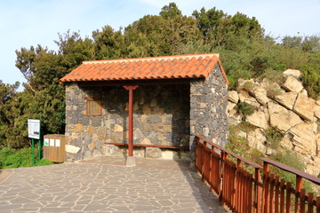 Fototapeta na wymiar Rural bus stop of stone in la gomera, Spain