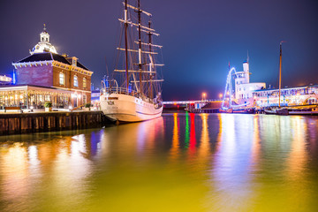 Harlingen, Netherlands - January 09, 2020. Boat docked in downtown at night