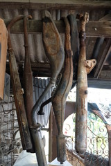 Equipment parts, exhaust, old motor, rusting, unused, hung