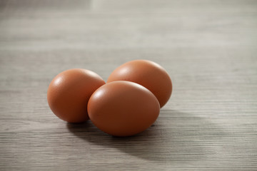 brown eggs on wooden table