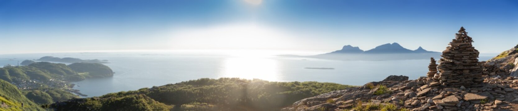 A panorama of a cairn in the foreground of the island Landegode outside Bod&oslash; city.