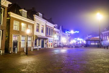 Fototapeta premium Harlingen, Netherlands - January 09, 2020. Traditional dutch houses at night