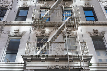 A White Fire Escape on the Side of an Old Beautiful White Building in Chelsea of New York City