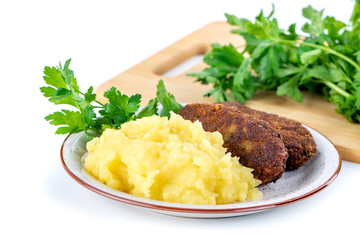 meatballs with mashed potatoes and parsley on a white background