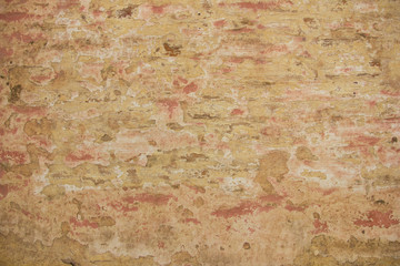pared gastada de ladrillos de colores claros