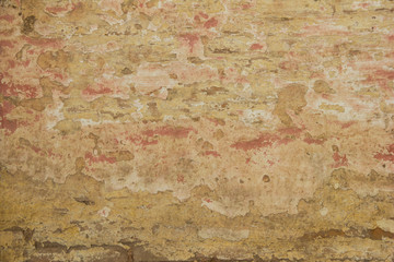 pared gastada de ladrillos de colores claros