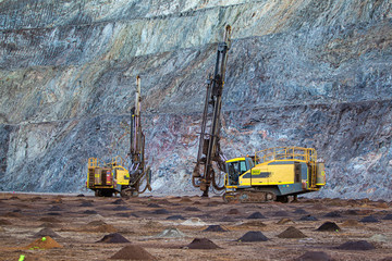drill rigs on iron ore mine