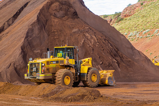 Loader at iron ore stock pile