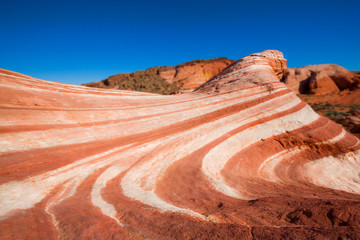 Red coloured rock layers at small wave in Valley of Fire, USA
