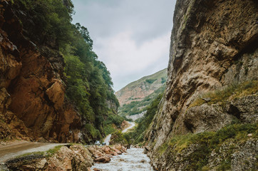 Cycling mountain road. Misty mountain road in high mountains.. Cloudy sky with mountain road