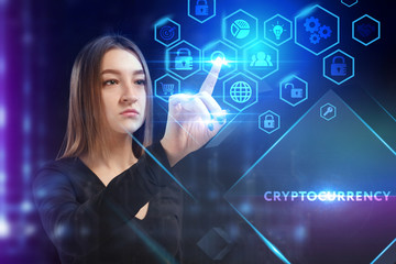 Business, Technology, Internet and network concept. Young businessman working on a virtual screen of the future and sees the inscription: Cryptocurrency