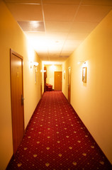 Empty long corridor in the modern hotel building