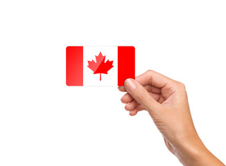 Beautiful hand holding Canada flag card on white background
