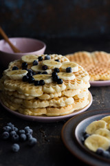 Waffles with various fruits and maple syrup