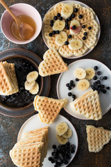 Waffles with various fruits and maple syrup