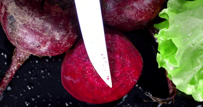 Fresh pulp of ripe beets with knife.