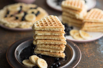 Waffles with various fruits and maple syrup