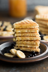 Sweet waffles with banana, blackberries and maple sirup.