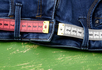 measuring tape on blue  jeans