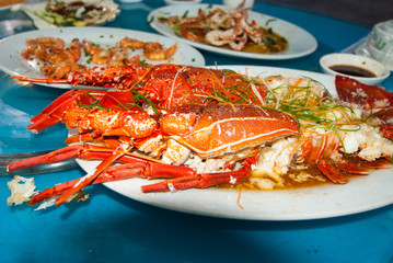 Lobsters cooked with spices and herbs on a plate