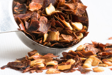 Red Pepper Flakes Spilled from a Teaspoon