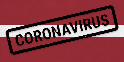 Flag of Latvia on paper texture with stamp, banner of Coronavirus name on it. 2019 - 2020 Novel Coronavirus (2019-nCoV) concept, for an outbreak occurs in the Latvia.