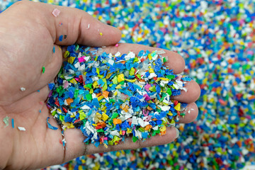 Close-up of plastic polymer granules. hand hold Polymer pellets. polymer plastic. compound polymer.