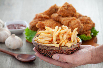 french fries with tomato sauce and fried chicken