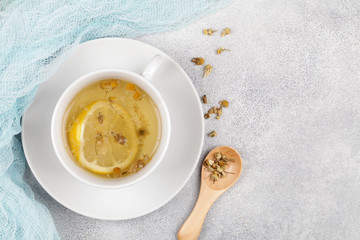 herbal chamomile tea on blue background