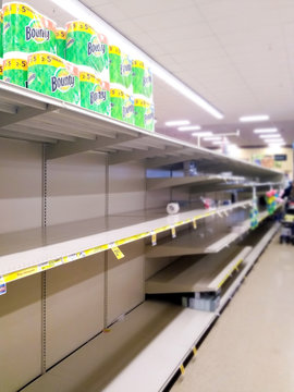 Empty Store Shelf In The Super Market. Coronavirus Epidemic. People Bought Up All Grocery Store. A Few Wads Of Toilet Paper On The Shelves. Quarantine.14 Mar 2020 California USA