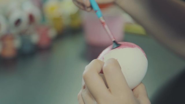 Little Boy Painting Easter Eggs