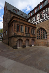 Fototapeta na wymiar Marburg. Germany. Building in the courtyard of the Church of St. Elizabeth. The medieval church was built by the Order of the Teutonic Knights in honour of St. Elizabeth of Hungary.