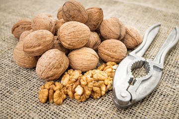 Walnut kernel background. Nutcracker with walnut