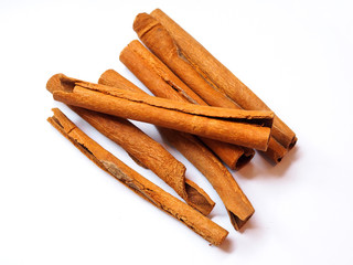 Top view of cinnamon sticks isolated on white background.