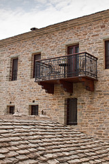 Beautiful terrace with railing, stone house