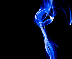 Blue smoke on black background