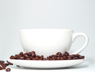 coffee bean on coffee cup on white background