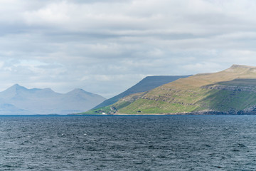 Kirkjubour on the coast of Skopunarfjordur with Magnus Cathedral and St. Olaf's church.