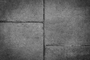 concrete background with seams darkened at the edges