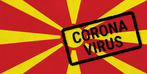 Flag of Macedonia on paper texture with stamp, banner of Coronavirus name on it. 2019 - 2020 Novel Coronavirus (2019-nCoV) concept, for an outbreak occurs in the Macedonia.