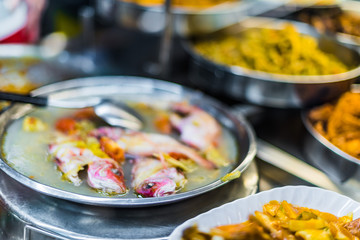 Traditional Asian food ingredients and dishes sold in a singapore restaurant