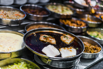 Traditional Asian food ingredients and dishes sold in a singapore restaurant