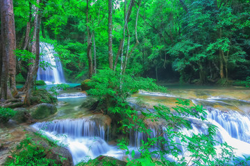 The beautiful Erawan cascade waterfall with turquoise water like heaven and sunlight at the tropical forest ,Kanchanaburi National Park, Thailand