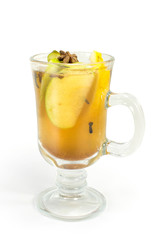 Cocktail with apple, lemon and cloves in a glass on a white background