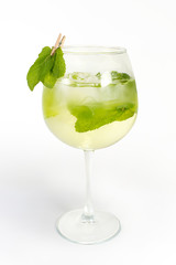 Cocktail in a glass with peppermint on a clothespin