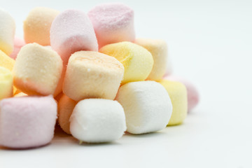 pastel colored marshmallows, isolated on white background