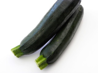 young green zucchini on a white background