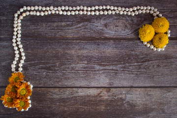 Small yellow chrysanthemums on a dark background